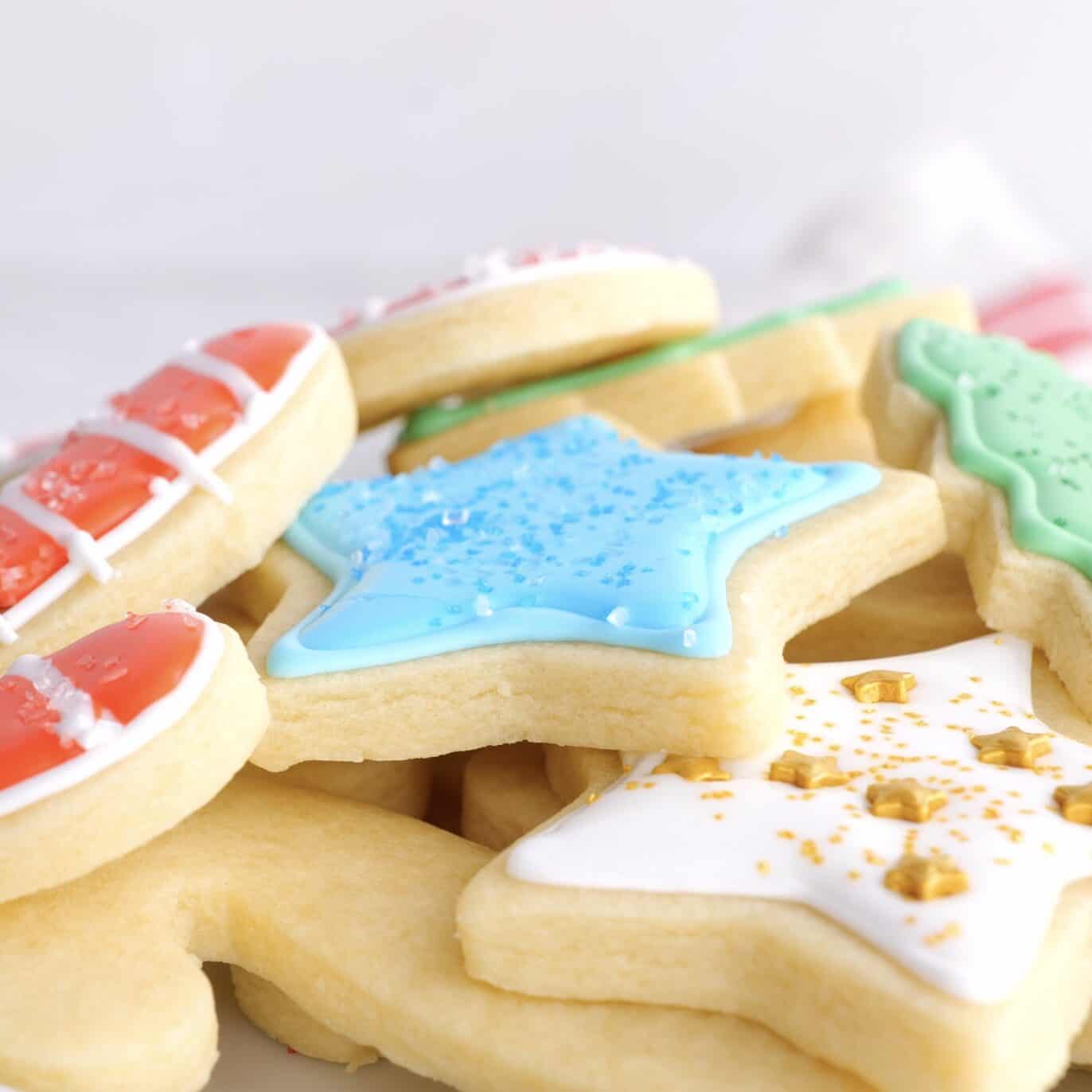 cut out sugar cookies with icing and sprinkles.