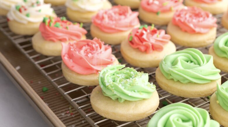 frosted lofhouse cookies on a wire rack