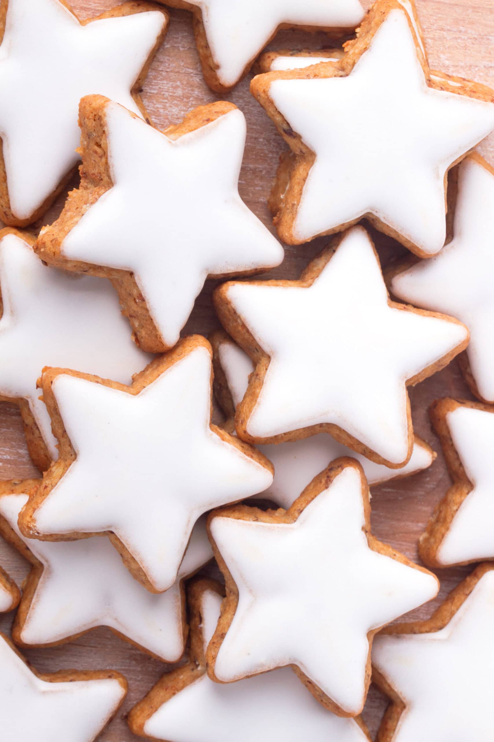 white sugar cookie icing on top of cut out star cookies.