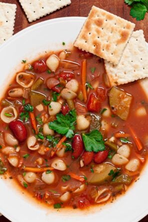 minestrone soup in a white dish