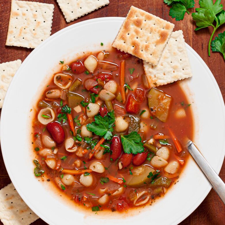 minestrone soup in a white dish