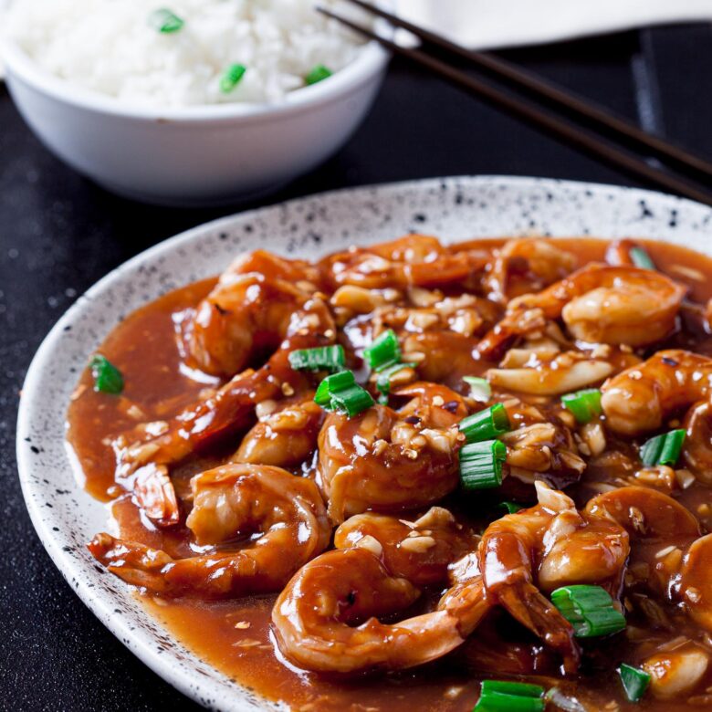 Shrimp Stir Fry on a plate with a bowl of rice