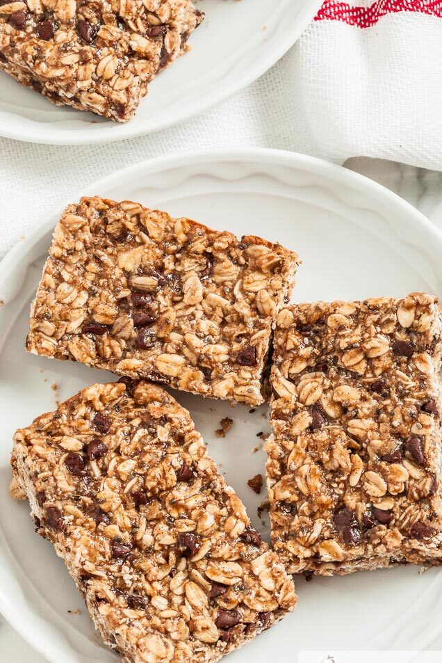 three chocolate chip protein granola bars on a plate