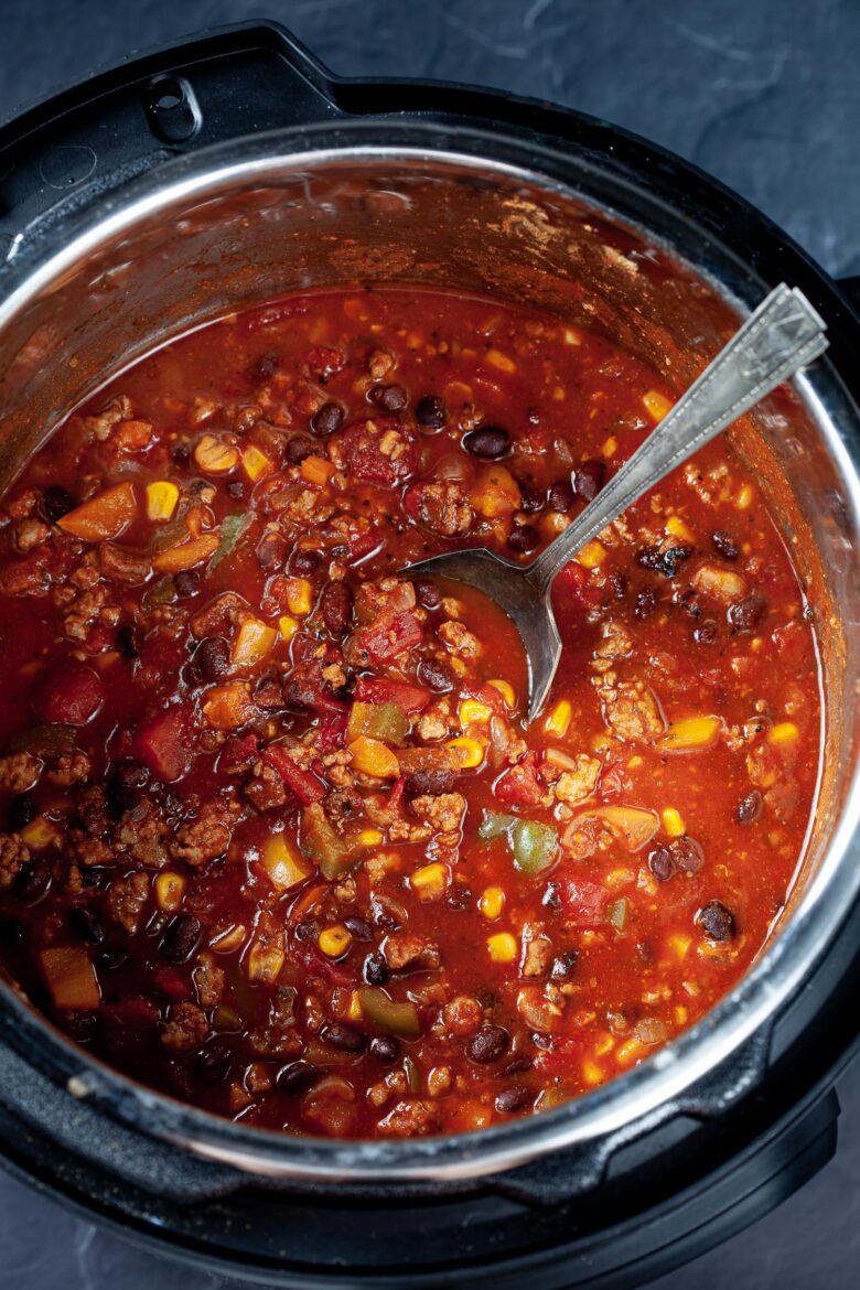 a spoon in the middle of chili in an Instant Pot