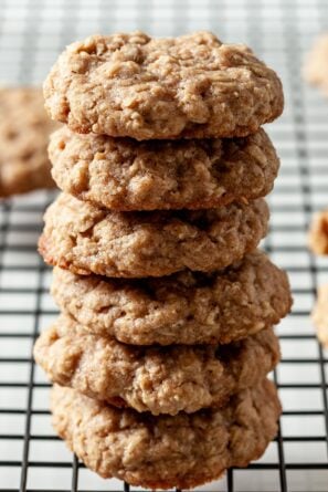 6 oatmeal cookies stacked on top of each other on a wire rack