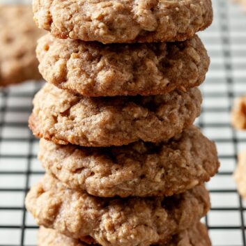 6 oatmeal cookies stacked on top of each other on a wire rack