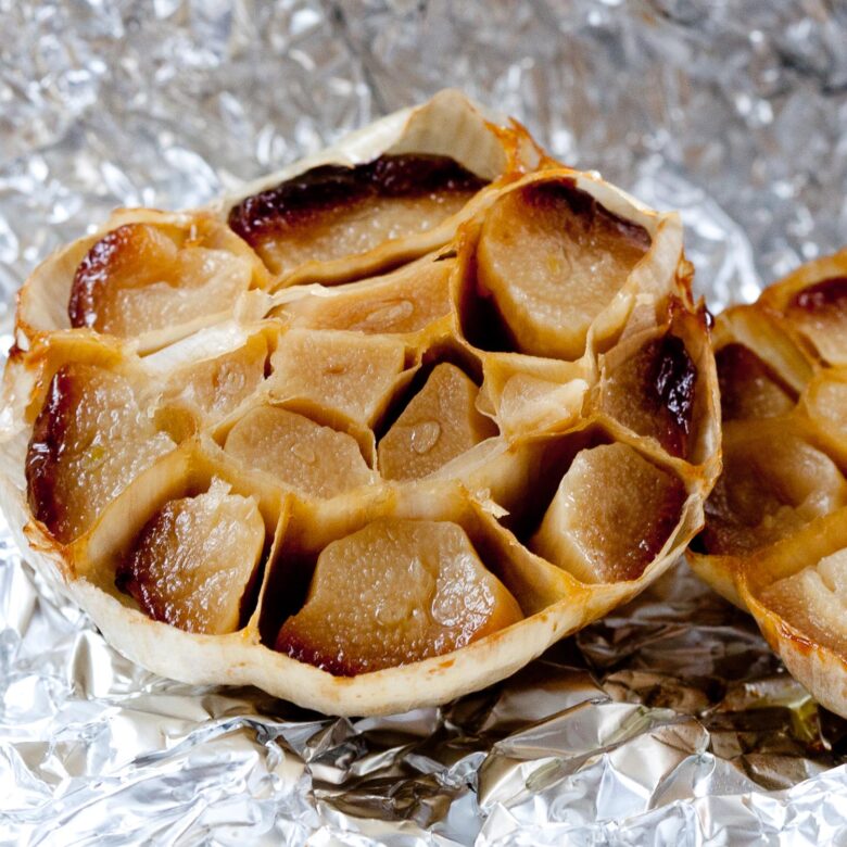 half a head of roasted garlic on aluminum foil