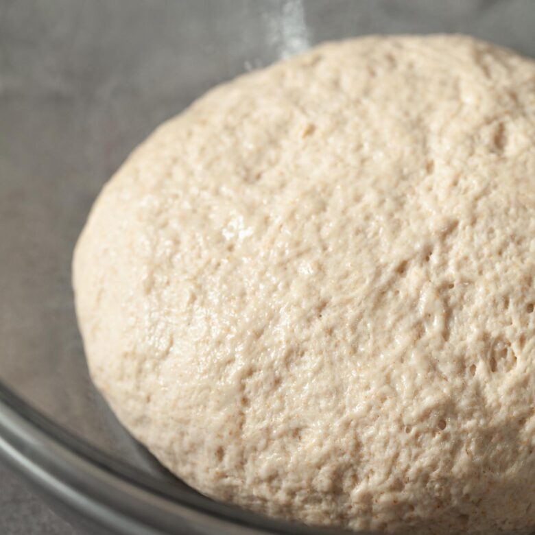 Uncooked dough sitting in a bowl.