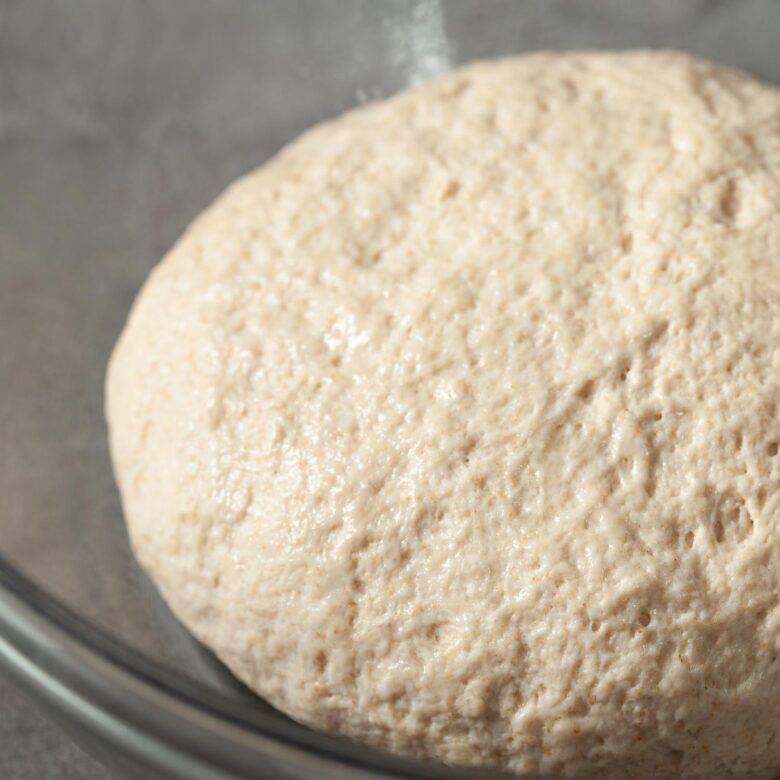 Uncooked dough sitting in a bowl.