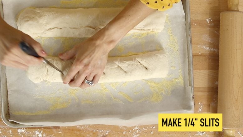 Cutting slits in the top of the bread