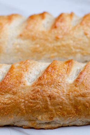 Two crusty French bread loaves side by side