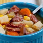 Ham Bone Soup with chopped ham, potatoes, and carrots in a bowl