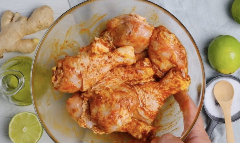 Tandoori Chicken coated with marinade and resting in a bowl