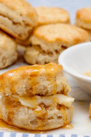 Buttermilk biscuit baked and drizzled with butter and honey.