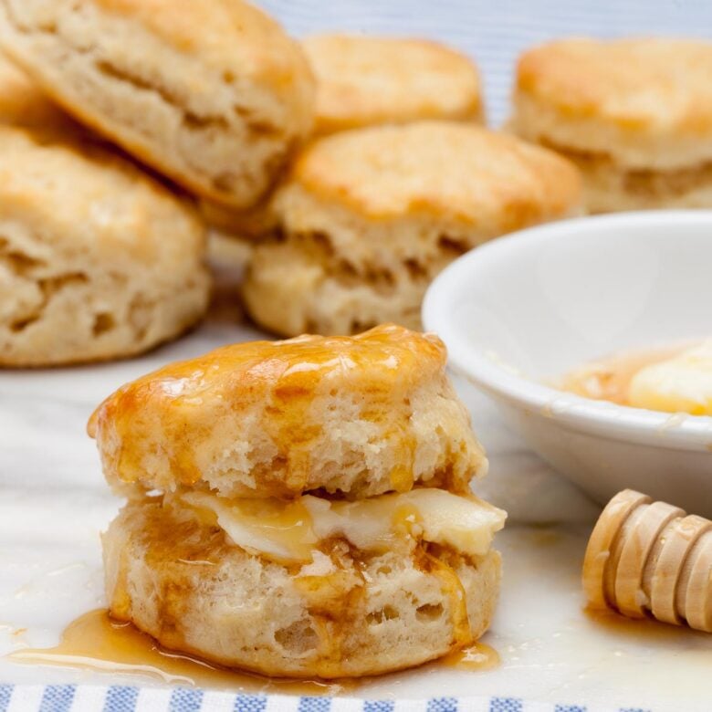 Buttermilk biscuit baked and drizzled with butter and honey.