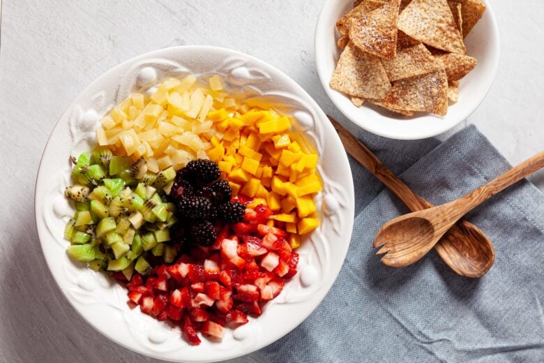 fruit salsa with mangos, kiwi, strawberries, pineapple, blueberries and apples