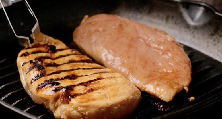Grilled Chicken Breast cooking on cast iron grill