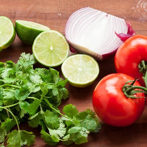 The ingredients for Corn Salsa laying out on a table.