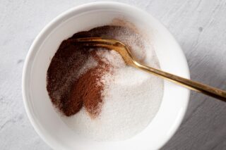 Cinnamon and sugar mixed together in a bowl to create the sprinkle.