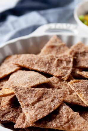 Baked cinnamon sugar tortilla chips in a decorative bowl.