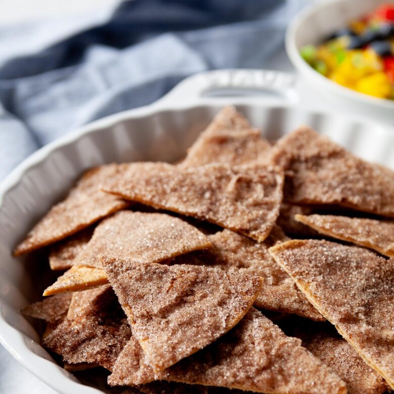 Baked cinnamon sugar tortilla chips in a decorative bowl.