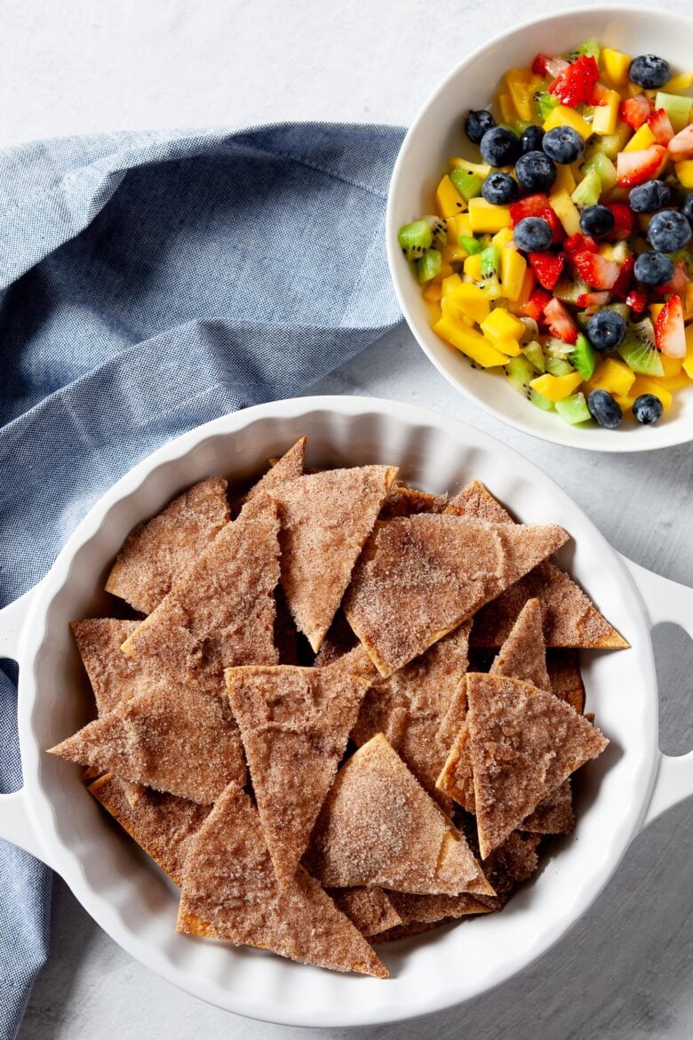 Crispy cinnamon sugar tortilla chips with fruit dip on the side.