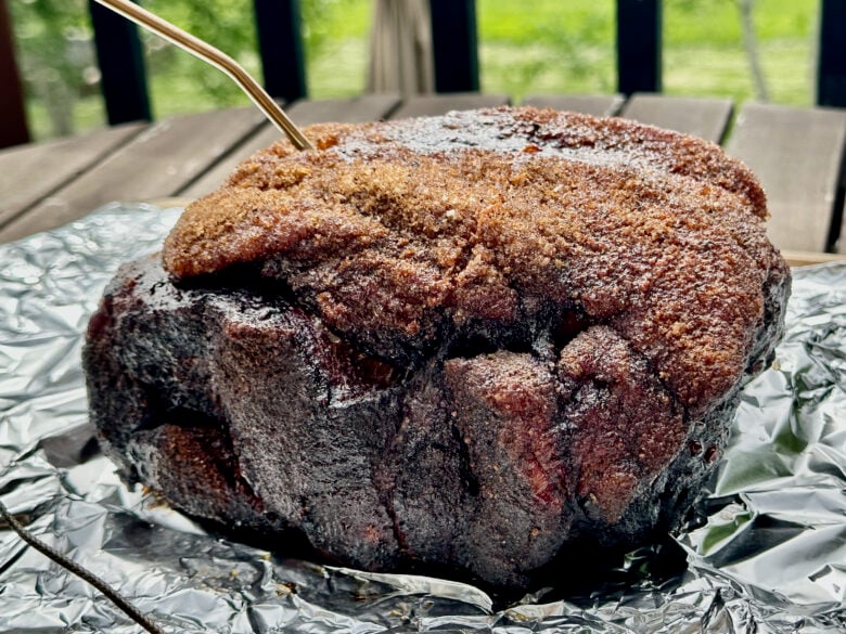 Pork butt roast with meat thermometer inserted
