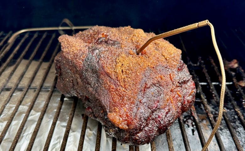 Smoked pork butt in smoker with fatty side up