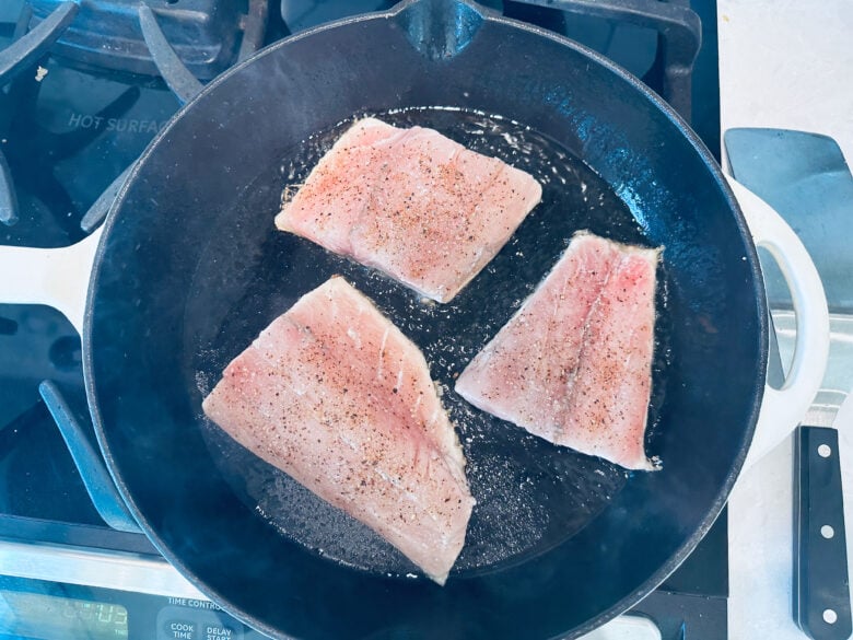 Barramundi filets cooking skin down