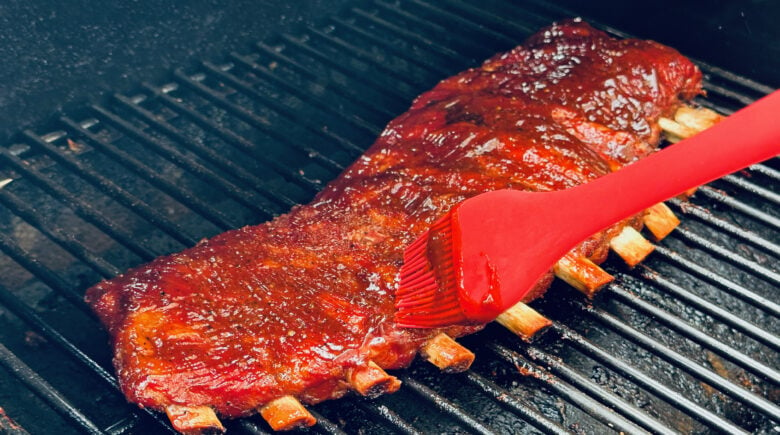 smoked ribs with sauce brushed on