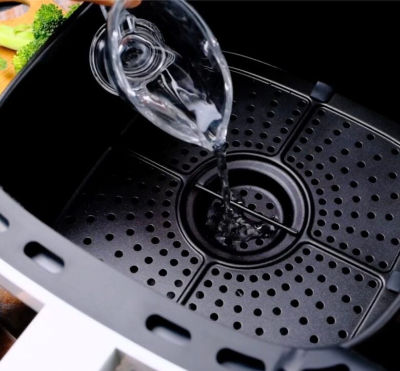 air fryer preparation with water on bottom
