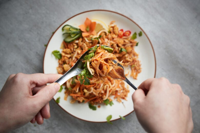 fish sauce being used in an Asian noodle dish. 