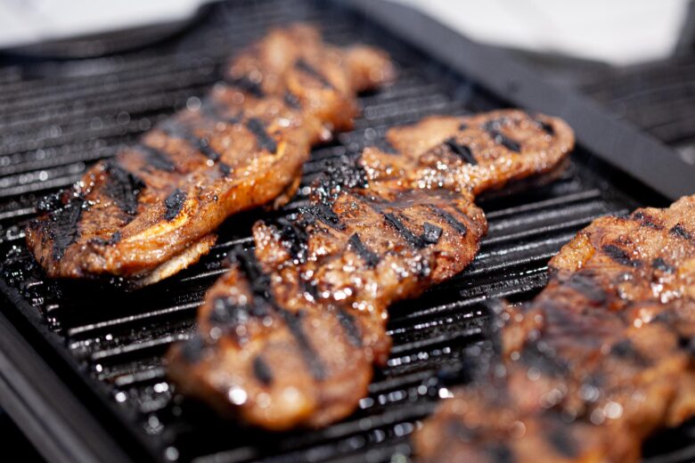 kalbi beef cooking on grill