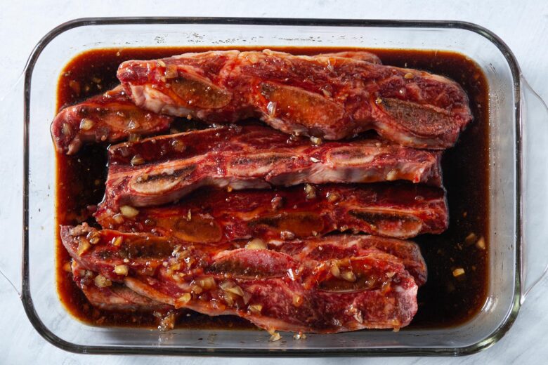 kalbi beef short ribs marinating in a dish