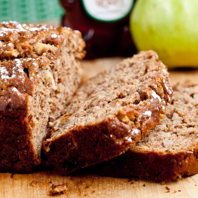 pear bread sliced on cutting board.