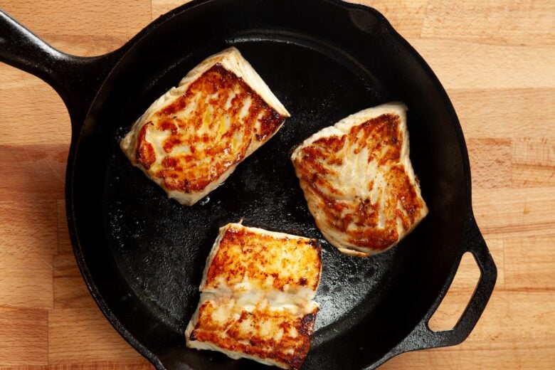 halibut searing in pan