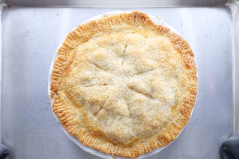 peach pie baked on baking sheet
