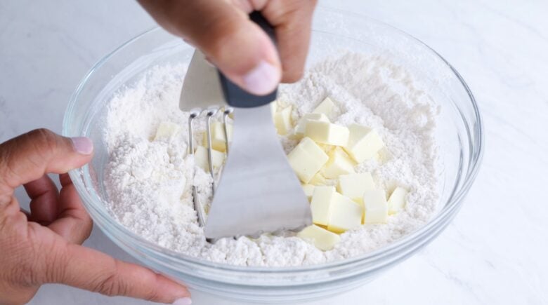 Pie dough ingredients mixed together in a bowl