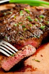 Grilled ribeye or t-bone steak on a cutting board