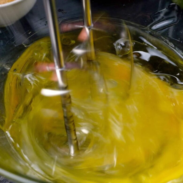 apple cake eggs mixing in an electric mixer