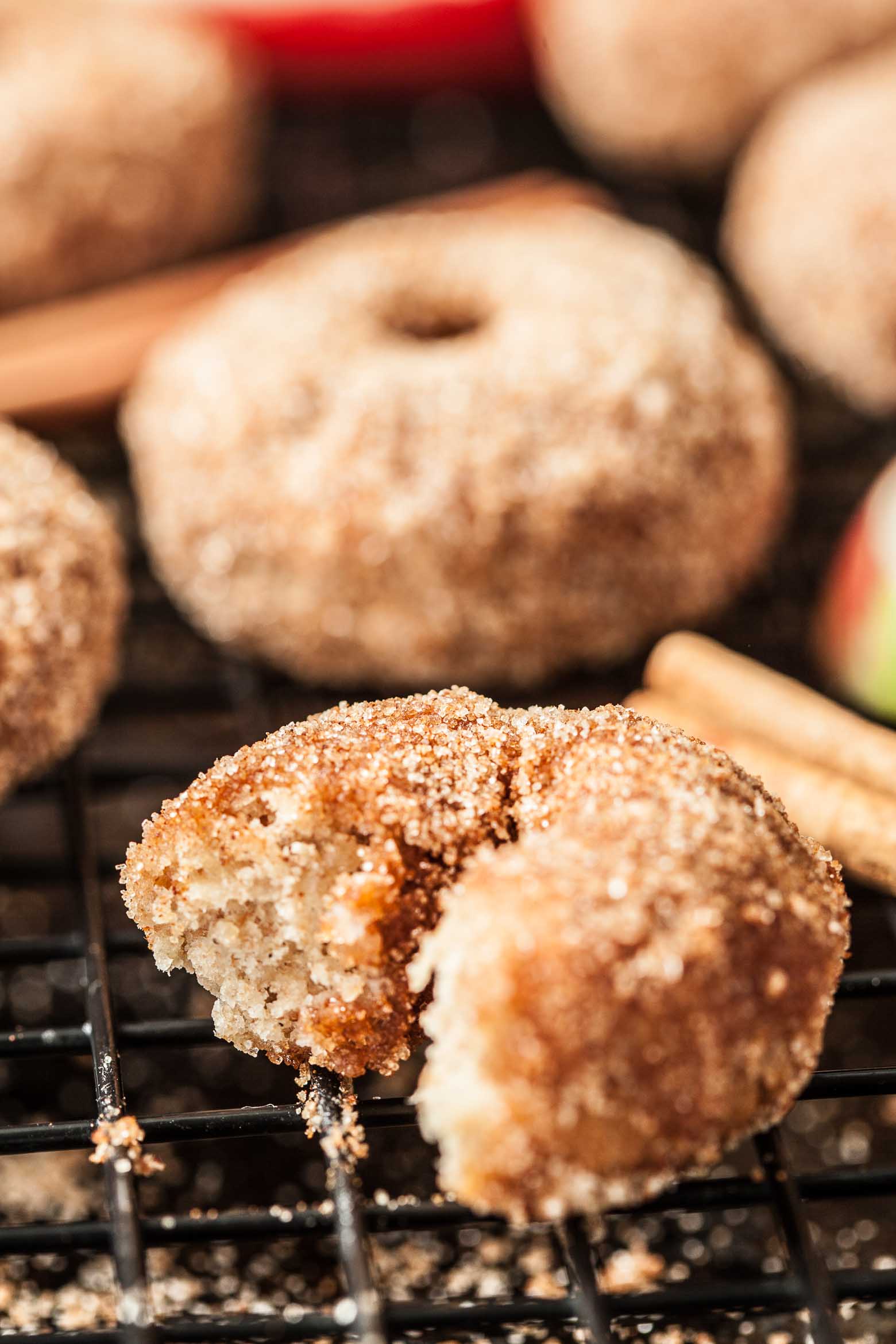 Close up of donut with a bite taken out of it.