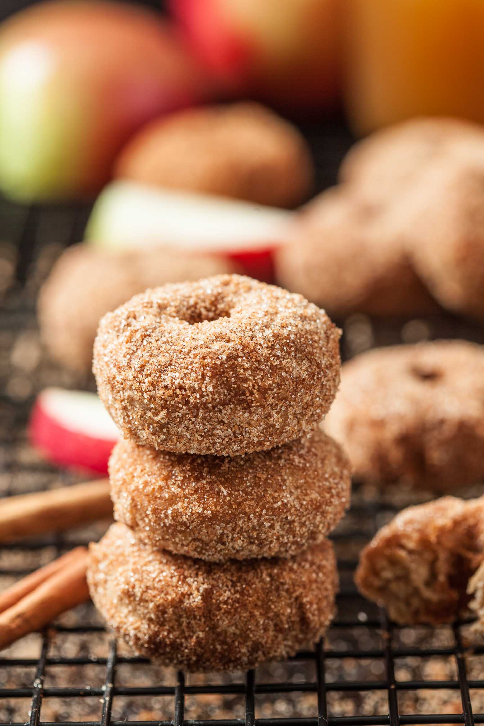 Stack of three cinnamon apple donuts.