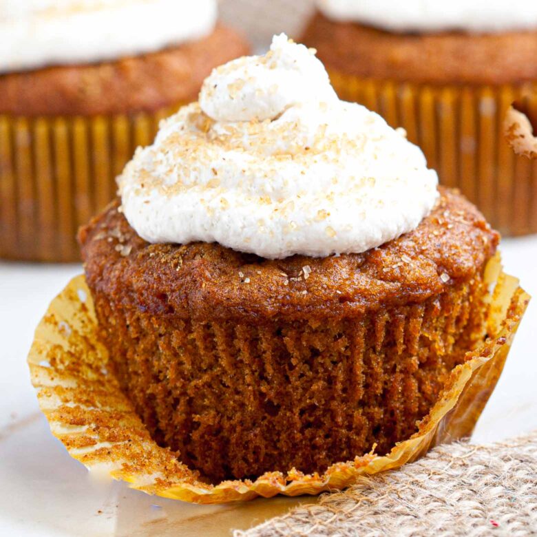 Pumpkin Cupcakes with whipped cream frosting.