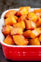 Roasted butternut squash in a red dish