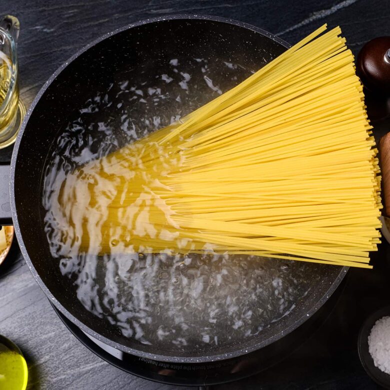 Spaghetti Noodles Cooking in a pot of water.