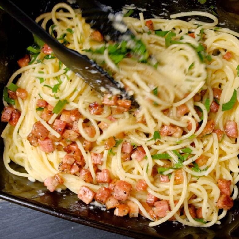 Spaghetti Carbonara Being Tossed.