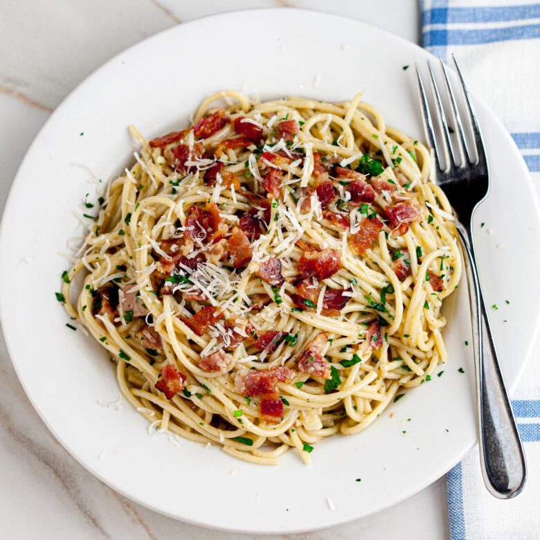 Spaghetti Carbonara on a Plate with a Fork.