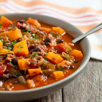 butternut squash chili in a bowl with spoon