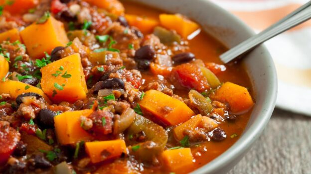 butternut squash chili in a bowl with spoon
