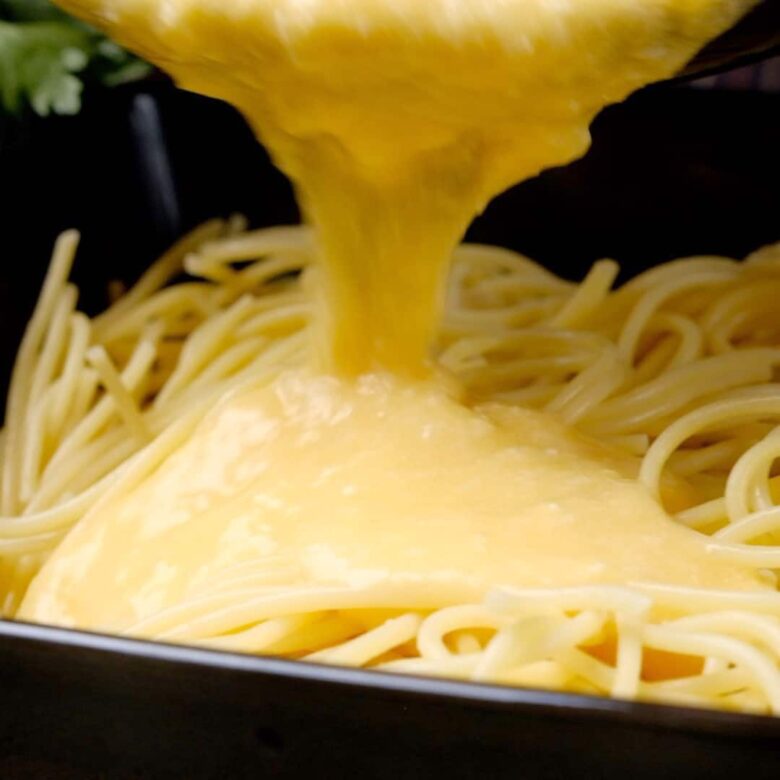 Spaghetti Carbonara Sauce Poured Over Pasta.